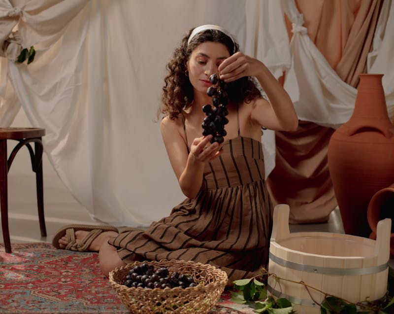 a woman making wine